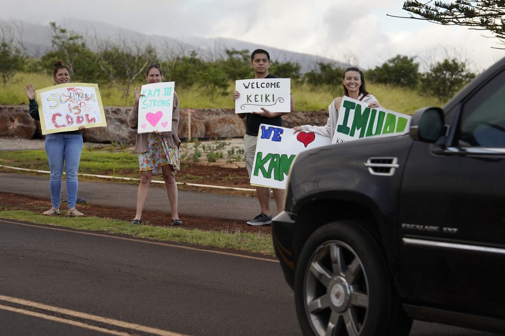 Supporters welcome students to the temporary Pulelehua campus of King Kamehameha III Elementary School Monday, April 1, 2024, in Lahaina. Kam 3’s original build was destroyed in the Aug. 8 fire. (Kevin Fujii/Civil Beat/2024)
