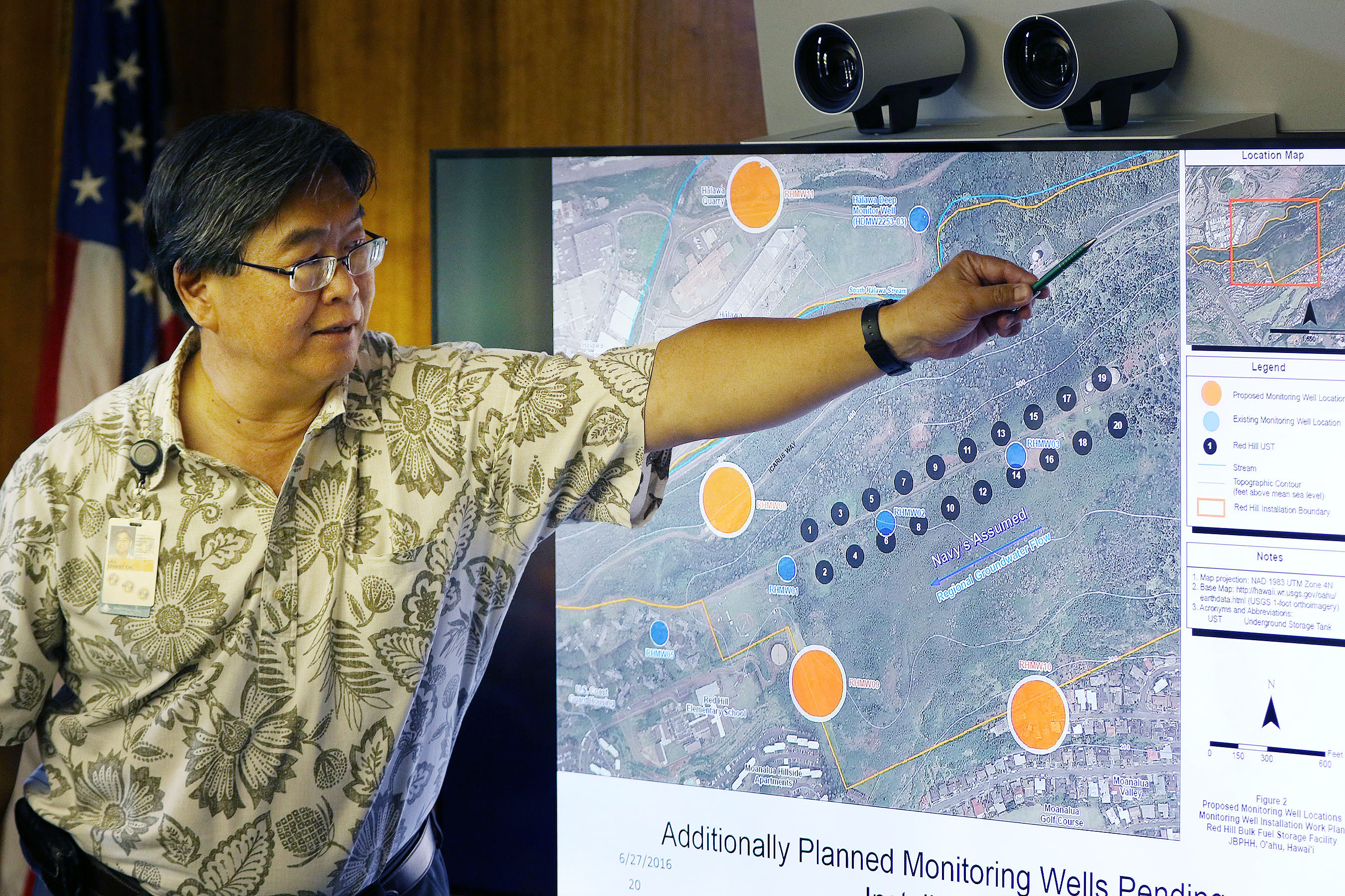 Board of Water Supply Ernest Lau points to areas near the Navy's 20 fuel tanks below Red Hill by the black dot looking things below his left hand during EPA teleconferenced meeting with the BWS board. 28 june 2016