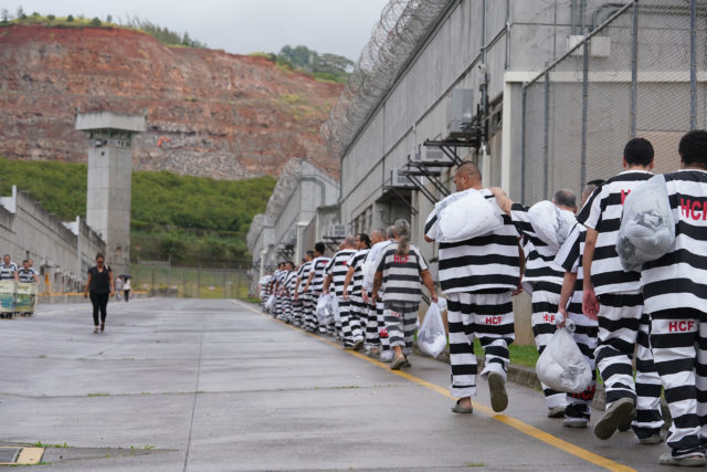 Halawa Correctional Facility inmates move along on main street back to their module.