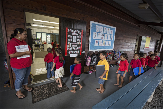 Students walk into classroom at the Nawahiokalani'opu'u Hawaiian Immersion School in Keaau, Hawaii.